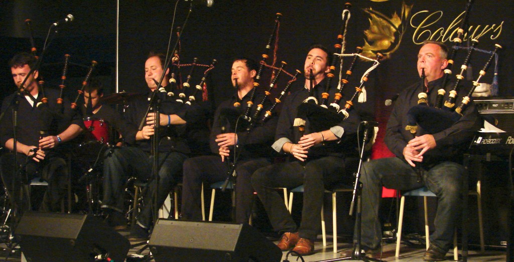 five highland bagpipe players